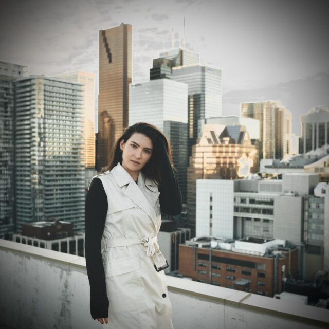 Photo of Vivian with a background of buildings